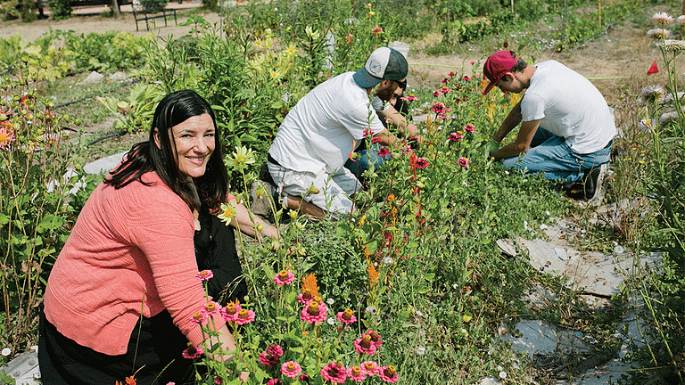Anya Hobley and other camphill california community members work in the garden